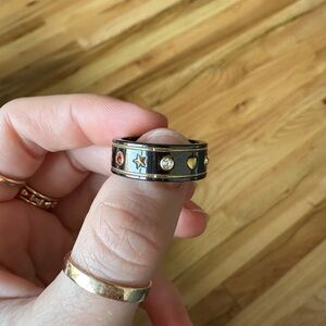 Black and gold ceramic icon ring with gemstones